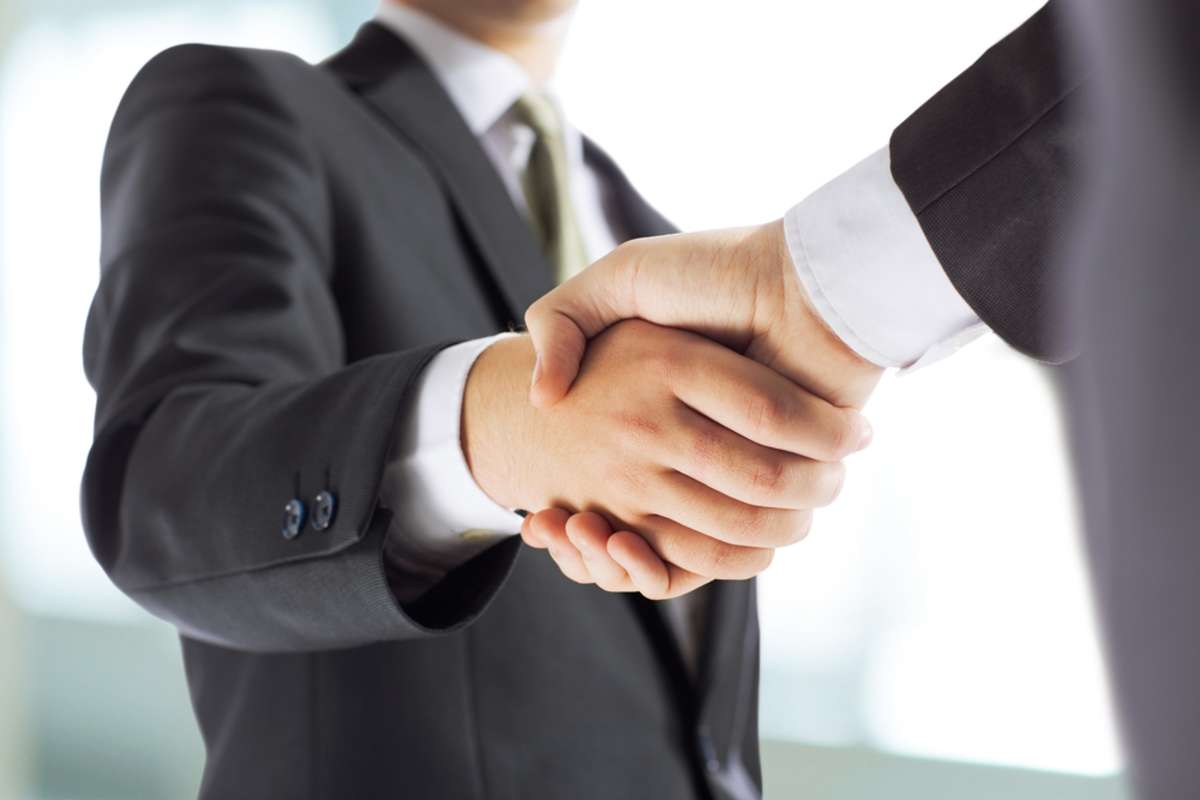 Businessmen shake hands, property management commercial concept