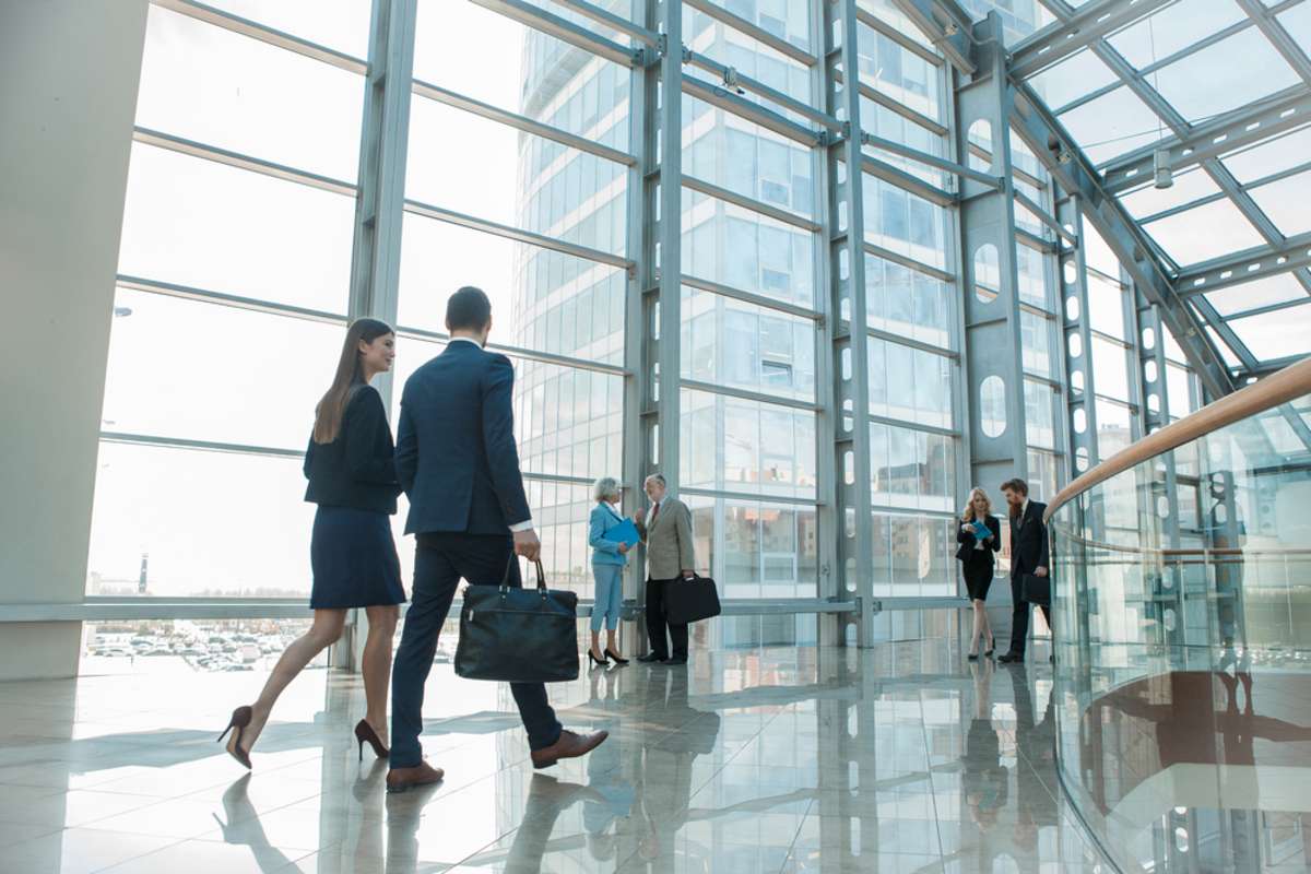 Business people walking in a building, common properties management concept