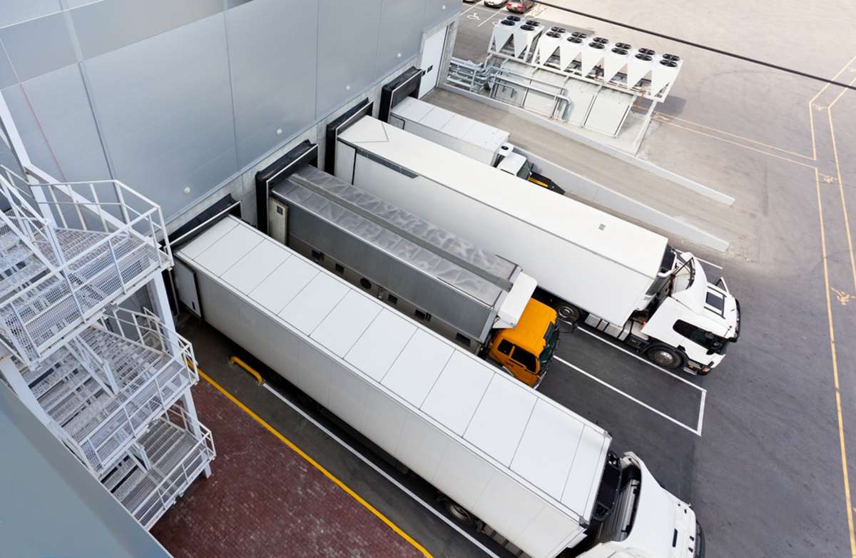 Trucks parked at a distribution warehouse, commercial real estate Chicago concept