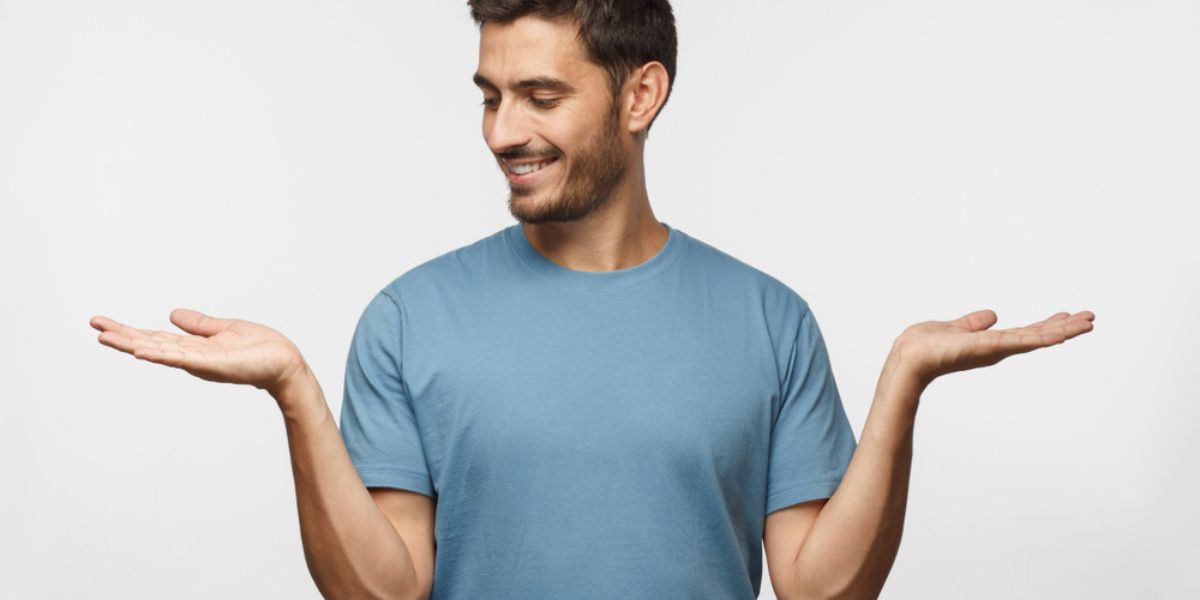 Portrait of young man choosing between 2 different options